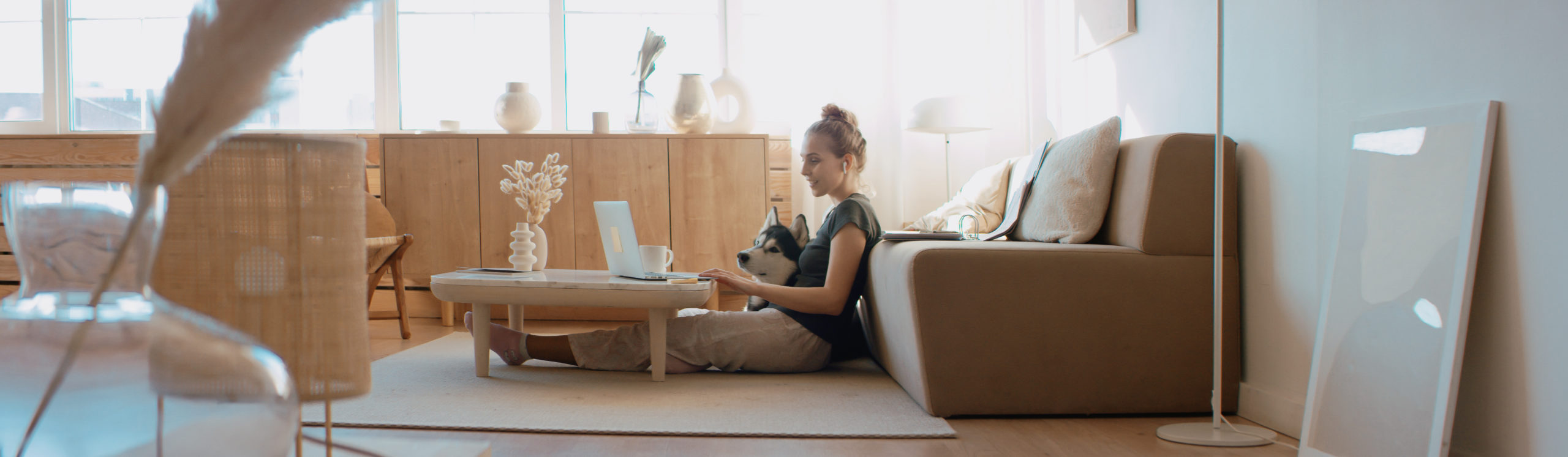 Caucasian female working from home, having a video work call, making notes